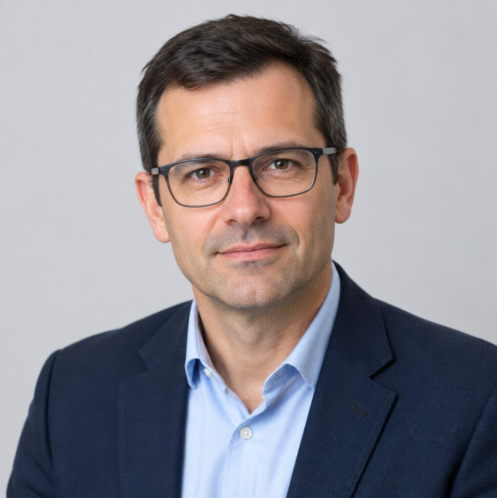 Studio portrait of a European man facilitator in his 40s